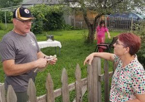 Abby Tilsner, Socialist Workers Party candidate for Albany County Executive, speaks with Christopher Conroy, a truck driver, about party’s program in Waterford, New York, Aug. 24.