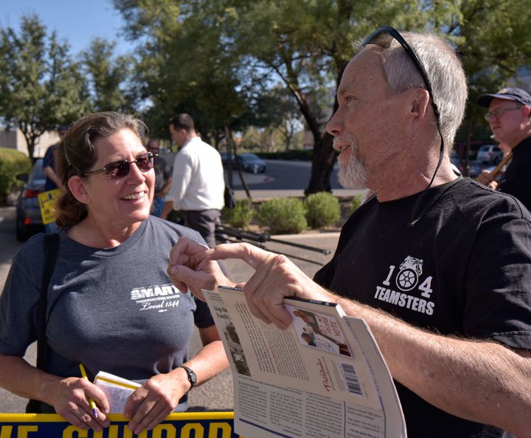 SWP member and rail worker Deborah Liatos speaks with Asarco striker Jim Wagener at Nov. 18 rally in Tucson, Arizona. He got a Militant subscription and In Defense of US Working Class.