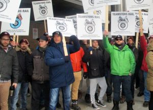 Rail workers picket CN headquarters in Montreal Nov. 26 shortly before tentative agreement announced. Fight for safety for workers and surrounding communities was at center of strike.