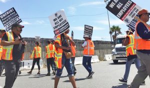 Truck drivers picket in Wilmington, California, Sept. 9, demanding NFI company bosses treat them as workers, not “contractors.” Farrell Dobbs explains how owner-operators, loaded by debt, are also exploited workers.