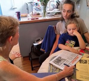Communist League member Felicity Coggan, left, speaks with Jennifer Holmes Nov. 16 in Sydney, Australia. “The whole system needs an overhaul,” said Holmes, “I’m paying full market rent on my own.” She bought Militant subscription and The Turn to Industry book.