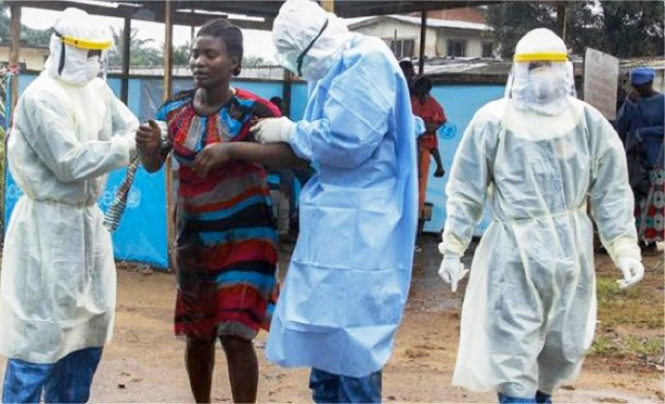 Cuban internationalists aid Ebola patient in Liberia in 2015. Some 250 Cuban volunteer doctors, nurses and other health workers led successful 2014-15 fight to end epidemic in West Africa.