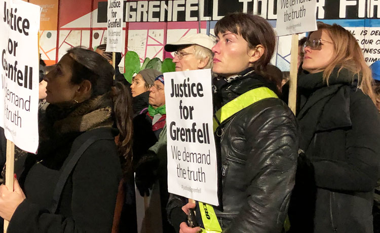 Demonstrators protest Nov. 14 in London in one of monthly “silent marches” marking 2017 fire in Grenfell Tower where 72 people died after flammable cladding on building ignited.