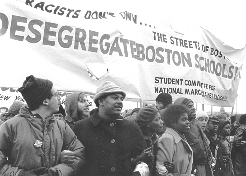 December 1974 march in Boston to support school desegregation. Mass meetings, protests and defense of school buses beat back attacks organized by Democratic Party leaders. Battle was a “decisive combat experience for an entire layer of the party leadership,” Barnes says.