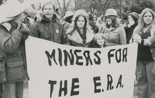 Left, unionists across U.S. joined march of 5,000 in Austin, Minnesota, April 1986, to back UFCW Local P-9 against Hormel. Above, UMWA contingent in labor march for Equal Rights Amendment, Richmond, Virginia, January 1980. Leaders of Coal Employment Project, which helped women get mining jobs, hold banner. Right, Ed Sadlowski, Steelworkers Fight Back candidate for union president, speaks at Detroit rally, Feb. 5, 1977. Ranks used campaign to seek control over their union and end to USWA officials’ connivance with steel bosses.