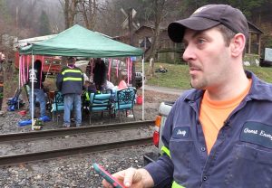 Coal miner Dustin Maynard, right, talks to press at miners’ blockade of rail tracks outside Quest mine in Kimper, Kentucky, Jan. 14. Protest builds on earlier action at Blackjewel mine.