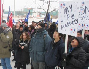 Aircraft refuelers in Quebec, on strike against Swissport Canada, and other unionists rally at company offices in Montreal Jan. 15 demanding higher pay and adequate on-the-job training.