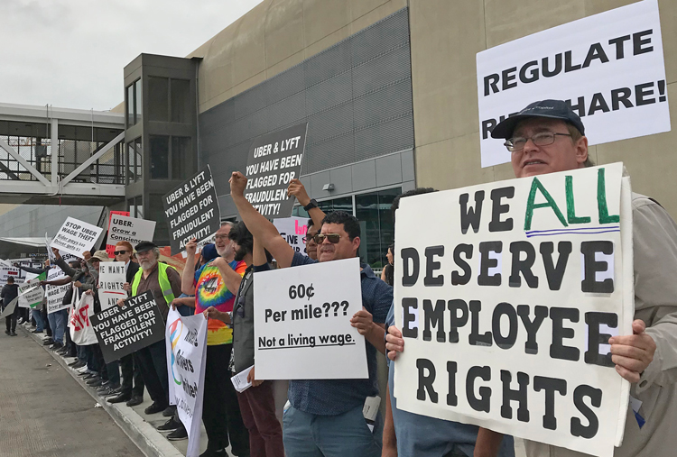 Uber and Lyft drivers picket Los Angeles airport May 8, 2019, demanding to be treated as workers, not con-tractors. To win, SWP says, fight is needed to organize “one union for all drivers.”