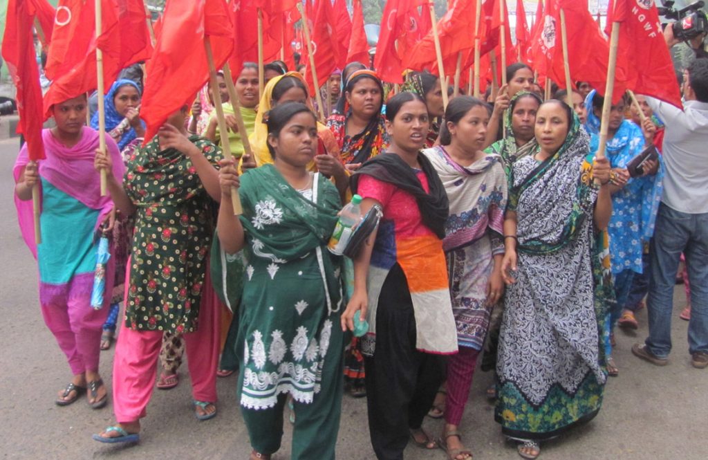 Women garment workers in Dhaka fighting for union rights, better wages and conditions, October 2014. Bangladeshi “fashion” industry workforce of 4 million is 80% female. Women in these factories have joined union struggles, advancing their confidence and status.