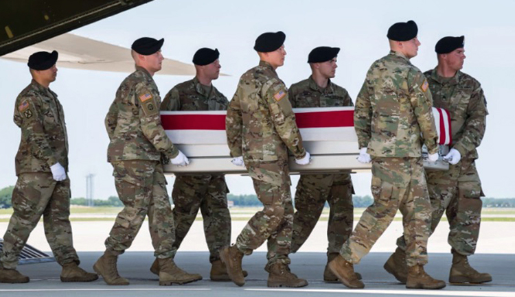 Dissatisfaction among working people over declining wages, conditions, impact of rulers’ wars fuels crisis in Democratic and Republican parties. Above, remains of GI killed in Afghanistan arrive at Dover Air Force Base, Delaware, July 2, 2019.