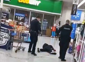 Cops stand over dying Steven Taylor after shooting and using Taser on him at San Leandro, California, Walmart April 18. Family has demanded cops be arrested and prosecuted. Inset, photo of Taylor.
