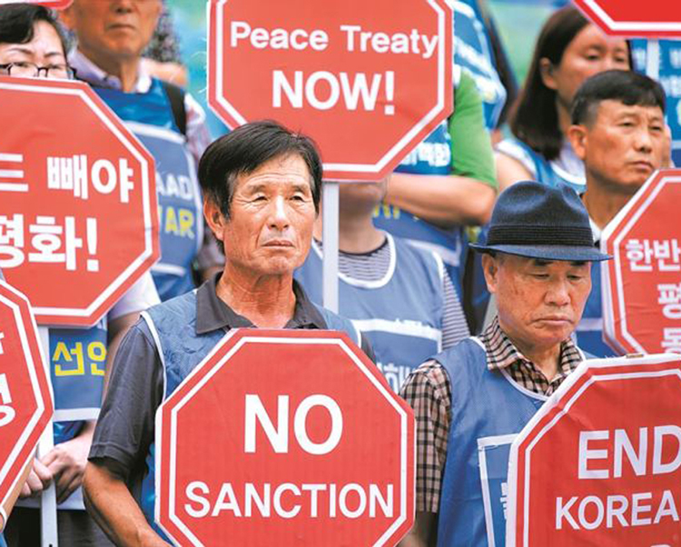 “Defendemos la lucha por la unificación de Corea”, dice mensaje de PST a pueblo norcoreano en ocasión del día nacional el 15 de abril. Arriba, protesta in Seúl, Corea del Sur, junio de 2019.