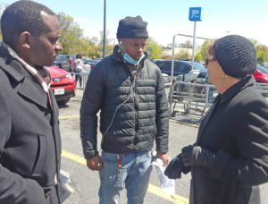 SWP candidates Malcolm Jarrett and Alyson Kennedy with Walmart worker Carlos Branch, center, in Washington, D.C. “Workers need to organize to defend themselves,” Kennedy said.