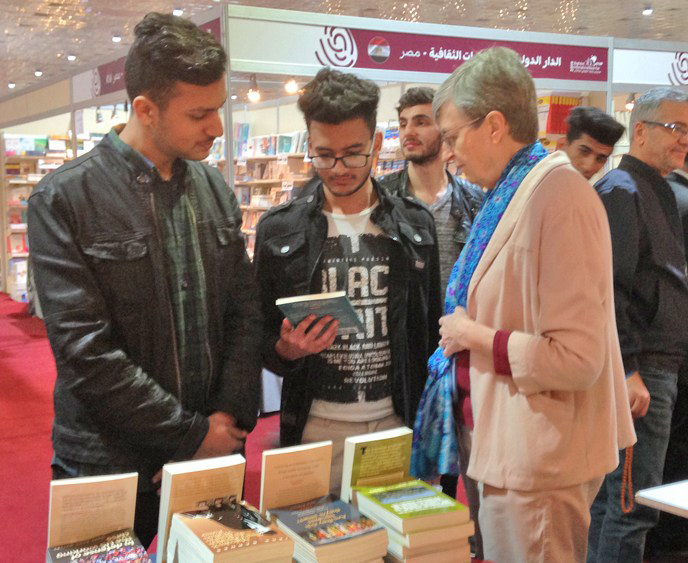 Catharina Tirsén discusses books by SWP leaders with Iraqi youth at February 2019 Baghdad International Book Fair.