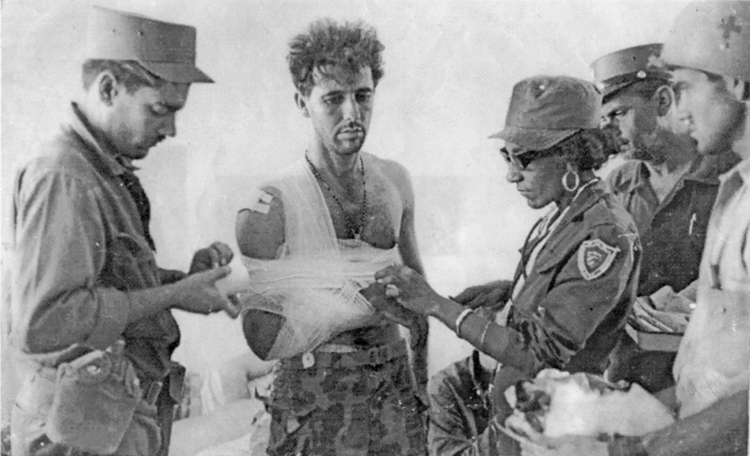 Wounded mercenary is treated after capture at defeated U.S.-backed Bay of Pigs invasion, 1961. Even before the revolution, July 26 Movement provided medical care equally to workers, peasants, its own combatants and enemy soldiers. Today health care is freely available to all.