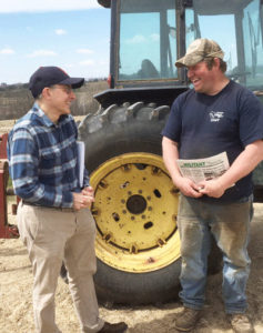 David Rosenfeld, left, SWP candidate for Senate in Minnesota, and Darin Von Ruden, president of Wisconsin Farmers Union, on Ruden’s farm. Von Ruden subscribed to Militant, purchased Red Zone: Cuba and the Battle Against Ebola in West Africa. “Capitalism doesn’t work well for health care, food,” he said.