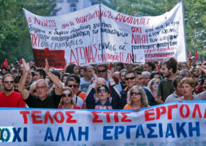 German court bars EU from using Berlin’s funding to bail out impoverished governments like Italy and Spain. German rulers offer instead to help EU make grants, accompanied by austerity regimens. Above, Nov. 6, 2012, rally in Greece against EU-imposed cuts on wages, pensions.