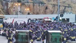 Striking immigrant waste workers block company plant in Beirut, Lebanon, May 12 in fight against steep pay cut.