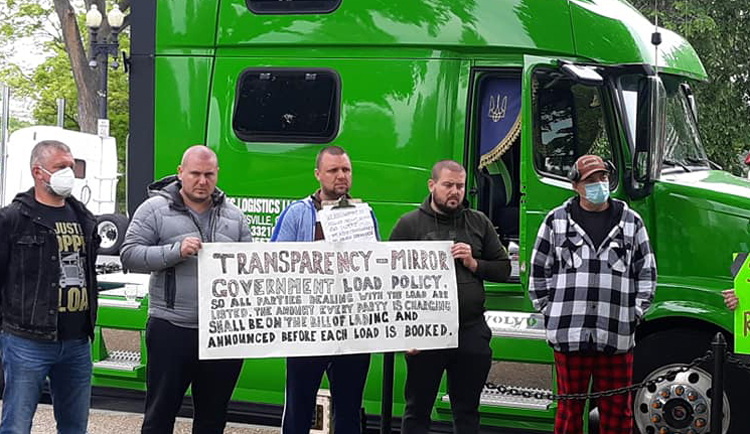 Truckers protest in Washington, D.C., in May, demanding an end to brokers’ price gouging.