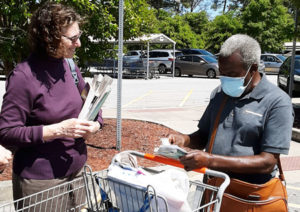 Marcus Kufi, right, gets Militant and Red Zone book in Atlanta area Walmart parking lot.