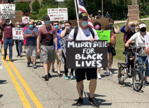 Several hundred march June 14 in Murrysville, Pennsylvania, one of thousands of protests in cities, towns and rural areas all across the country. Many involve youth new to protest actions.