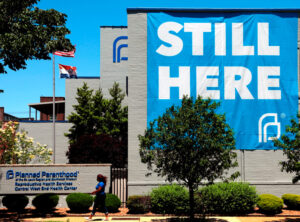 St. Louis Planned Parenthood, only clinic open in Missouri for women who choose to have an abortion, hangs huge banner May 29 after defeat of state officials’ move to shut it down.