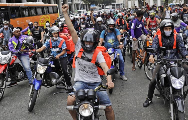 Thousands of motorcycle workers for Uber and other food delivery app employers protested July 1 in Rio de Janiero, above, Sao Paulo and other Brazilian cities in the largest action so far to resist bosses’ use of high un-employment to pit workers against each other and drive down their pay and conditions.