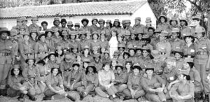 Members of Cuban Women’s Antiaircraft Artillery Defense Regiment leaving for Angola in 1988, to help defeat apartheid South Africa’s invasion. Vilma Espín, leader of Federation of Cuban Women, at center in white blouse.