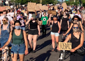 Above, June 26 protest in Minneapolis against police brutality. Inset, protesters kneel for 14 minutes — symbolizing time cops held Carlos Ingram Lopez face down April 21 causing his death — during June 24 march in Tucson to demand prosecution of cops who killed him.