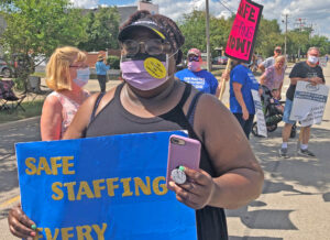 Striking Illinois nurses picket AMITA Health Center July 12 for better conditions, more staff.