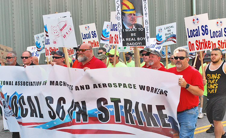 Shipyard workers on strike in Bath, Maine, and supporters march July 25 against company demands to expand subcontracting, cut back seniority rights and raise health care costs. “This is not about greed on our part,” said striker John LaPointe. “It’s about dignity,” and knitting together generations of workers.