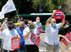 Jewish and Arab bus drivers demand better working conditions in Jerusalem in July.