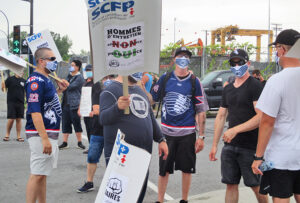 Port of Montreal Longshore picket July 27, during four-day strike against unsafe job schedules.