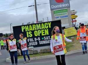 Dominion workers, on strike since Aug. 22, picket in Bay Roberts, Newfoundland, Sept. 13. Company takeback of $2 an hour hazard pay “was a smack in the face,” said one striker.