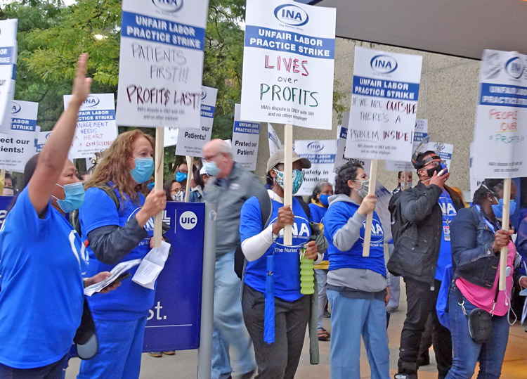 Members of Illinois Nurses Association, above, and other hospital workers at University of Illinois Hospital systems are out on strike, demanding increased staffing and safer conditions.