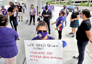 SEIU 32BJ union members demand jobs back, safe conditions, unemployment pay Aug. 13, after Delta airlines contractor Eulen America laid off 100 workers at Ft. Lauderdale airport.