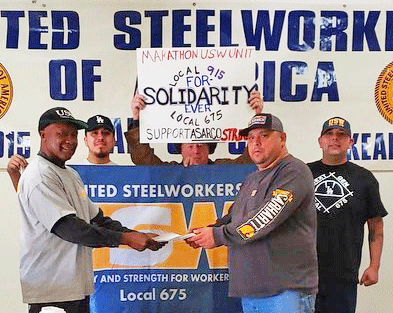 Delegation of refinery workers from United Steelworkers Local 675 in Los Angeles County presents donations to Asarco strikers in Arizona last December. Solidarity was key to the strike.