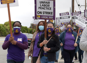 Health care workers picket in front of Fairmont Wellness Center in San Leandro, California, Oct. 8 during five-day strike at six public hospitals for safety for patients and themselves.