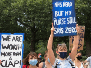 Nurses in London demonstrate Aug. 8 demanding pay raise. End of government pandemic benefits Oct. 31 means millions more workers face pay cuts, alongside rising joblessness.