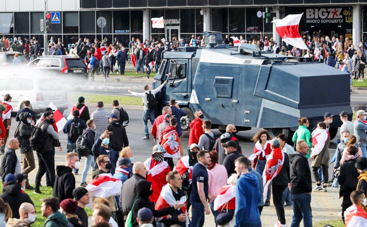 For two months Belarus has been convulsed by mass protests and workers strikes after President Alexander Lukashenko declared victory in rigged election. Above, protesters defy water cannon in Minsk, Oct. 4.