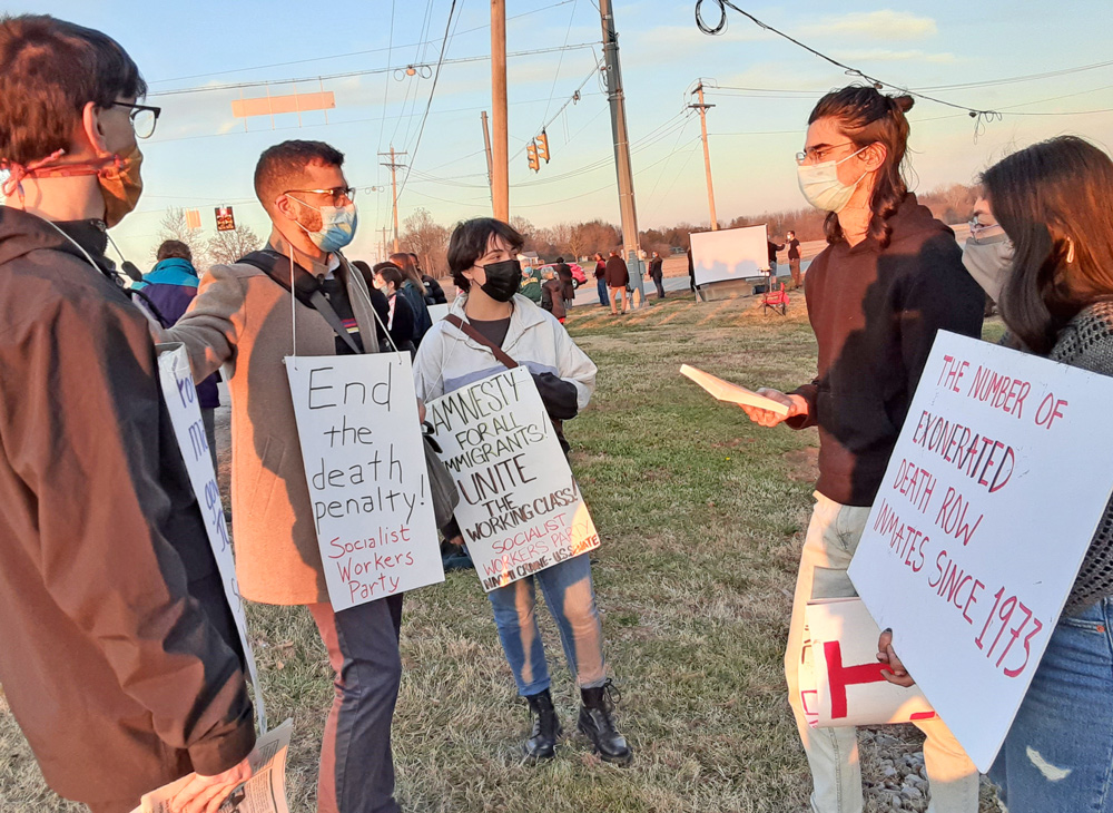 Dec. 10 protest outside federal prison in Terre Haute, Indiana, where U.S. gov’t carries out executions. Socialist Workers Party member Samir Hazboun, second from left, talks with Indiana University students. “Use of death penalty is a bipartisan attack on the working class,” he said.