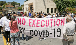 Rally near San Quentin State Prison in California July 9, where 20 inmates who tested positive for COVID-19 spoke out against conditions. Over 2,200 inmates were infected and 28 died.