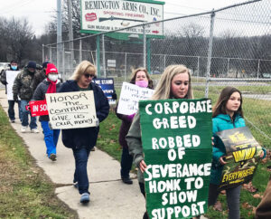 Remington arms workers march Dec. 5 in Ilion, New York, to demand severance pay, vacation pay, after bosses declared bankruptcy. Albany nurses fighting for contract joined in solidarity.
