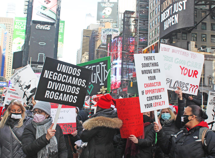 Laid off Marriott Marquis hotel workers in New York protest in Times Square Dec. 23 over cut in severance pay and bosses refusal to commit to bring them back if hotel reopens.