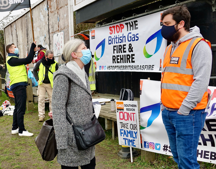 George McDonald, striking British Gas worker, talks with Pamela Holmes, Communist League candidate for London Assembly, on picket line in Sidcup, North Kent, England, Feb. 22.