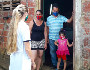 Medical worker visits family in Pinar del Río in Cuba this month. Volunteers have been mobilized during COVID pandemic to knock on thousands of doors to see if help is needed.