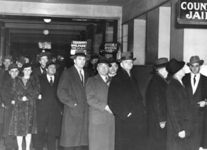 Eighteen SWP and Teamster leaders on their way to federal prison, Dec. 31, 1943. They were framed up for leading labor opposition to U.S. rulers’ war drive. James P. Cannon, third from right, partly obscured. Defendants were first victims of thought-control Smith Act.
