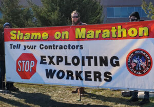 Iron Workers Local 512 members hold banner at union solidarity rally March 6 in support of Teamsters Local 120 oil workers locked out Jan. 22 by Marathon Petroleum in Minnesota.