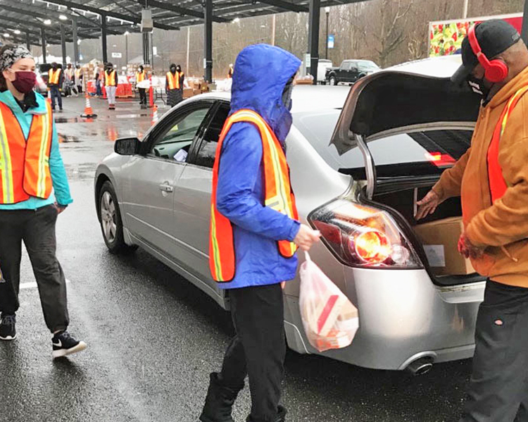 Volunteers give groceries to jobless workers at food bank in Lindenwold, New Jersey. In 15 states last year the percentage of working-age people with jobs fell to the lowest levels ever.