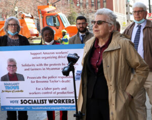 Maggie Trowe, with campaign supporters, speaks at March 12 press conference in front of City Hall to announce her campaign as Socialist Workers Party candidate for mayor of Louisville.